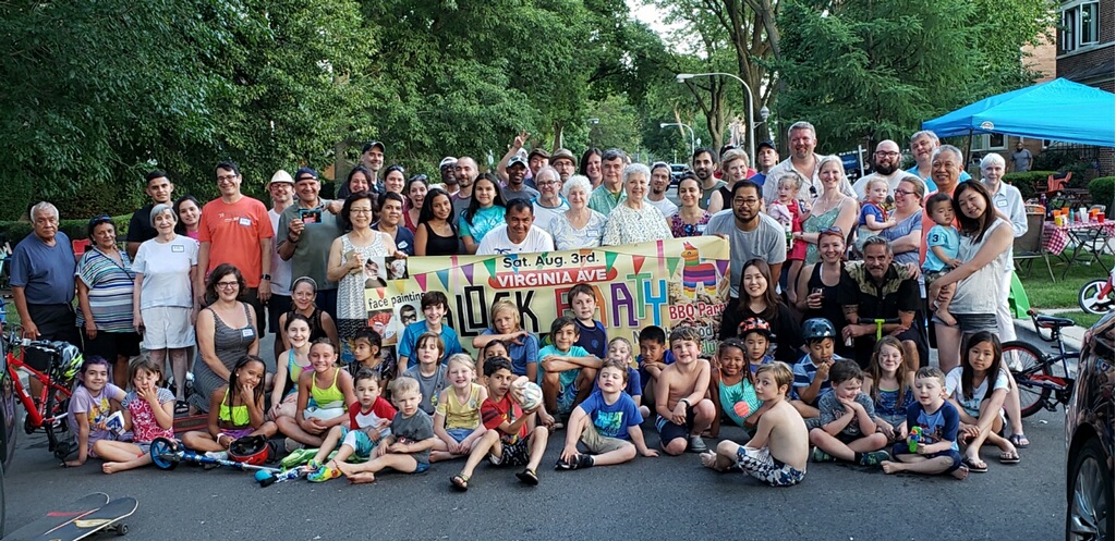 Block party group photo, many people gathered together smiling