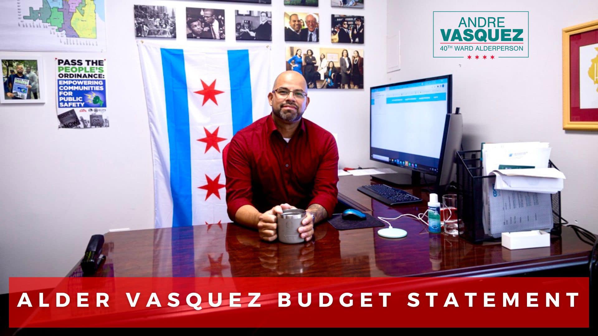 Alderperson Andre Vasquez sits at his desk and looks directly at the viewer.