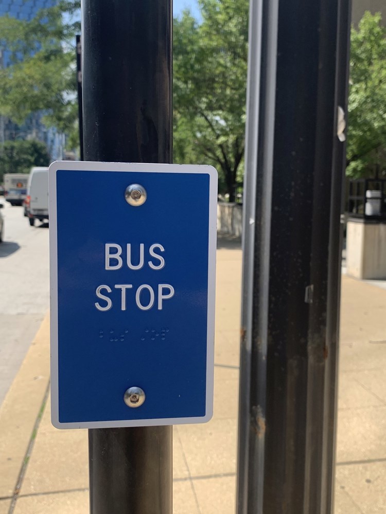 Blue CTA Bus Sign With Raised Letters On a Pole