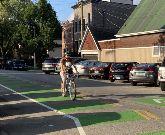 A cyclist riding along new Leavitt Greenway