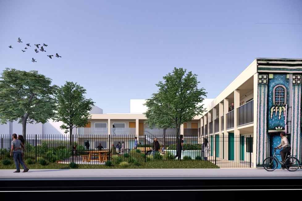 Front facing view of rendering of the proposed Haven on Lincoln, a two story white motel, including courtyard and mural.