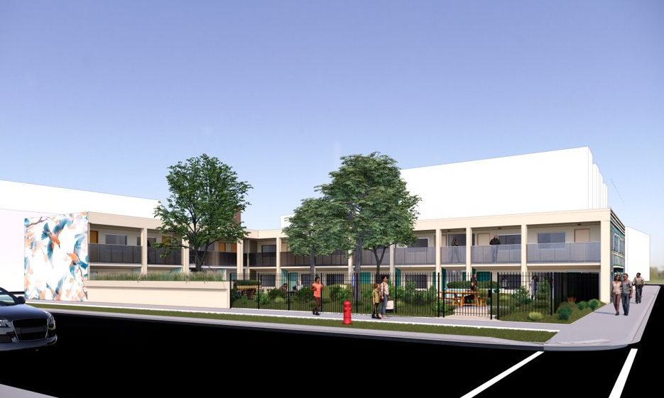 Side view of rendering of the proposed Haven on Lincoln, a two story white motel with courtyard and mural.