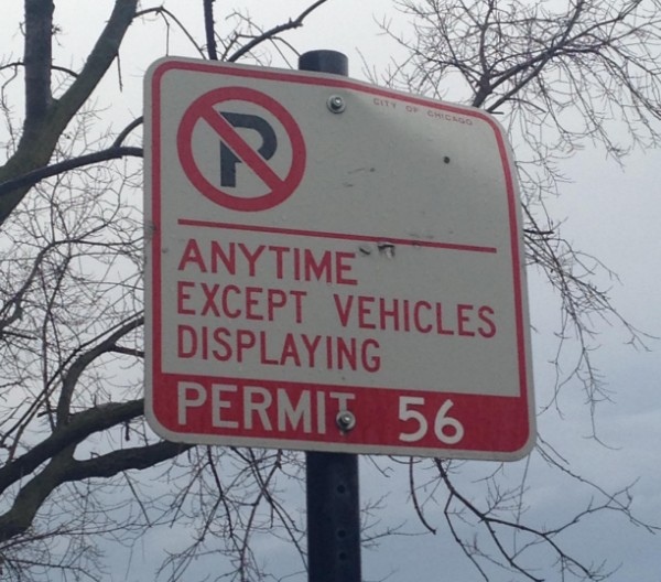 Residential Permit Parking sign against a grey sky